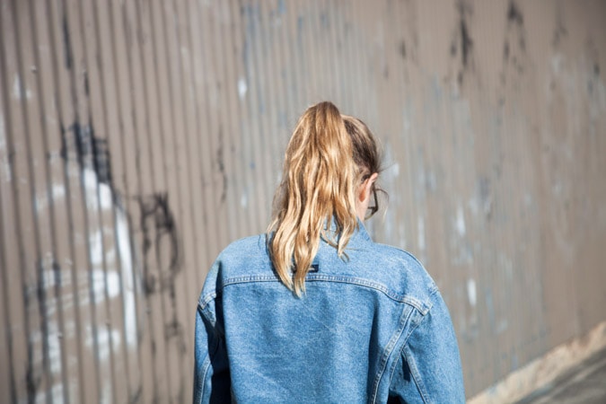 Girl walking with her head down